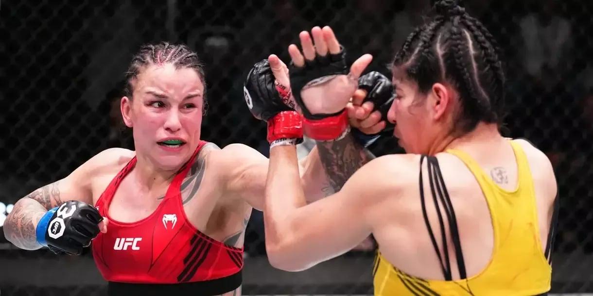 Raquel Pennington scrapping with Ketlen Vieira. Credits to: Chris Unger - Zuffa LLC.