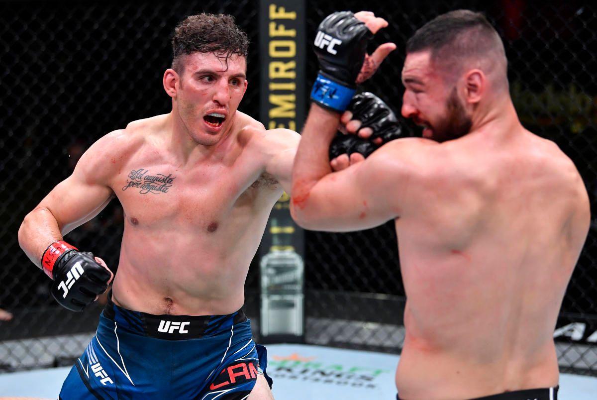 Aleksa Camur unloads a combination on Nicolae Negumereanu. Credit: Yahoo!