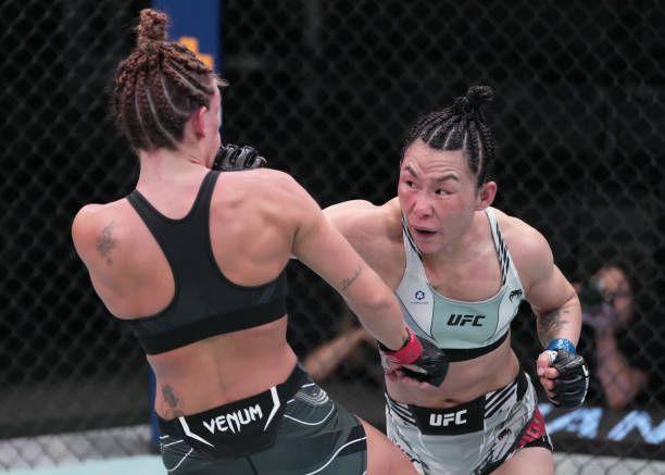 Yan Xiaonan throwing a straight-right on Mackenzie Dern. Credits to: Jeff Bottari-Getty Images.