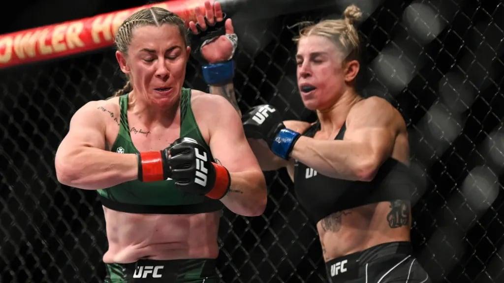 Molly McCann landing yet another compromising spinning elbow on Hannah Goldy. Photo by MMAJunkie.