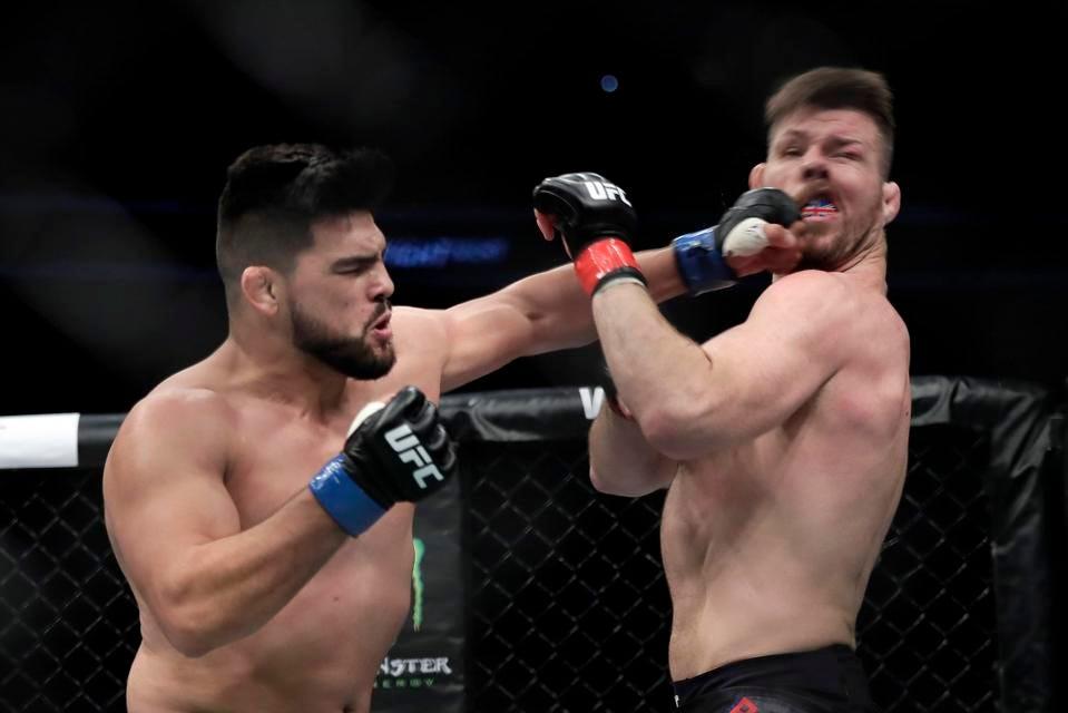 Kelvin Gastelum knocks out Michael Bisping. Credit: Hu Chengwei - Getty Images.