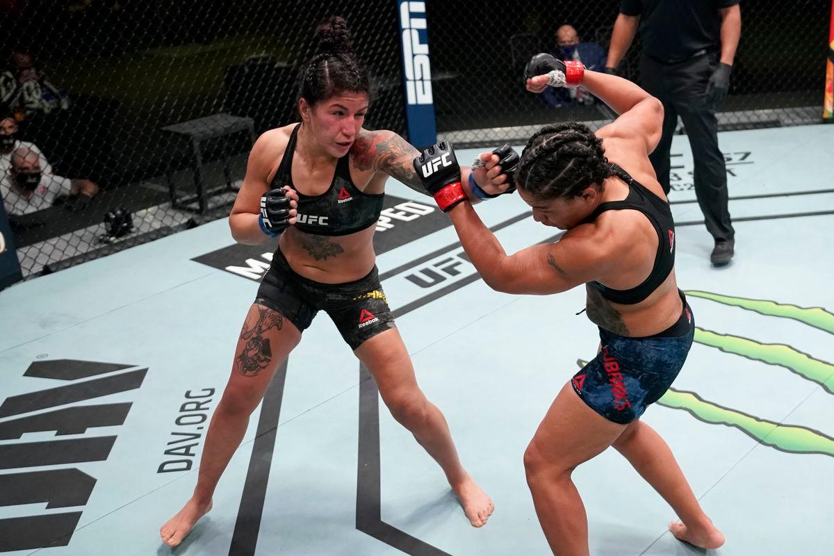 Pannie Kianzad cracks Sijara Eubanks with a left hand. Credit: MMA Fighting.