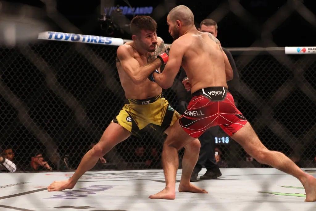 Matheus Nicolau and Matt Schnell scrapping. Credits to: Nathan Ray Seebeck - USA TODAY Sports.