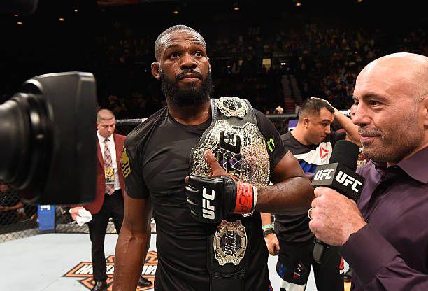 Jon Jones with Joe Rogan after retaining his belt at UFC 197. Photo by Josh Hedges, Zuffa LLC.