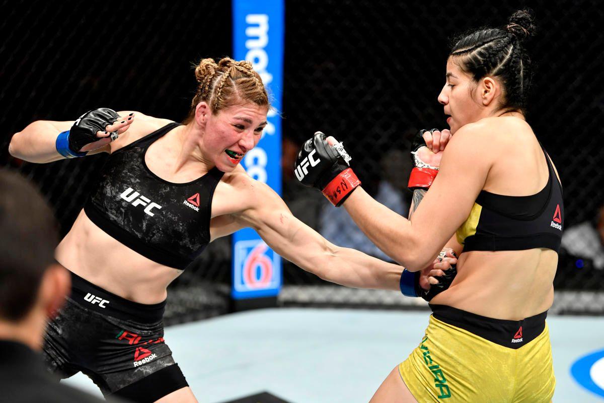 Irene Aldana lands a body shot on Ketlen Vieira. Credit: Yahoo Sports.
