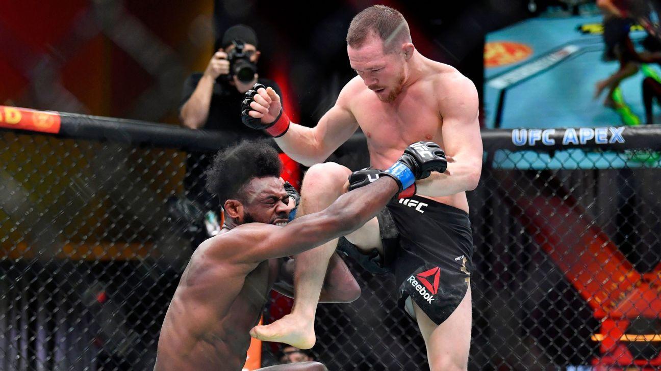 Petr Yan's infamous illegal knee against Aljamain Sterling. Credits to: Zuffa LLC.