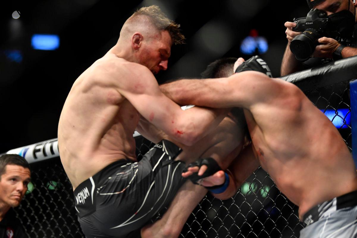 Dan Hooker lands a knee on Nasrat Haqparast. Credit: MMA Fighting.