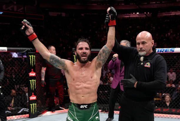 Clay Guida getting his hand raised as the winner. Credits to: Jeff Bottari-Zuffa LLC.