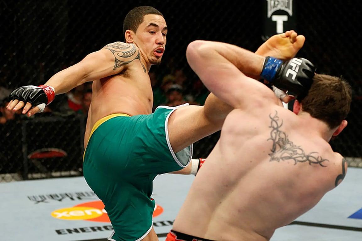 Robert Whittaker lands a head kick on Brad Scott in the finale. Credits to: Zuffa LLC-Getty Images