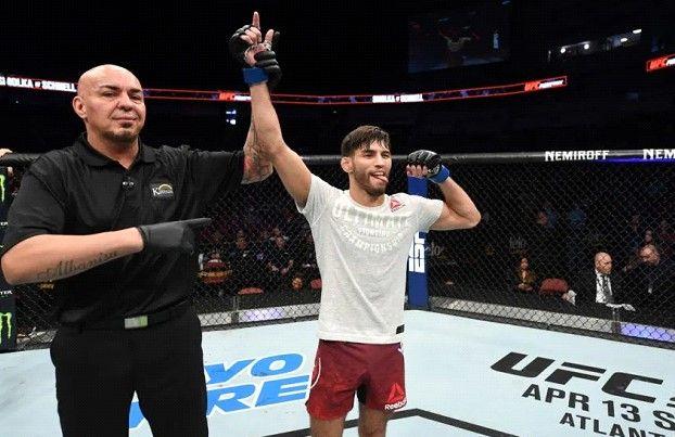 Matt Schnell gets his hand raised. Credits to: Josh Hedges/Zuffa LLC.