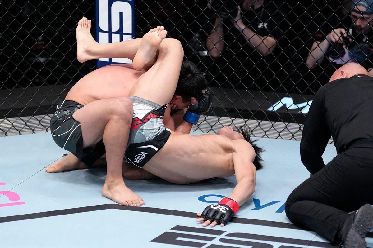 Tatsuro Taira locks in a triangle on Jesus Aguilar. Credit: MMA Junkie.