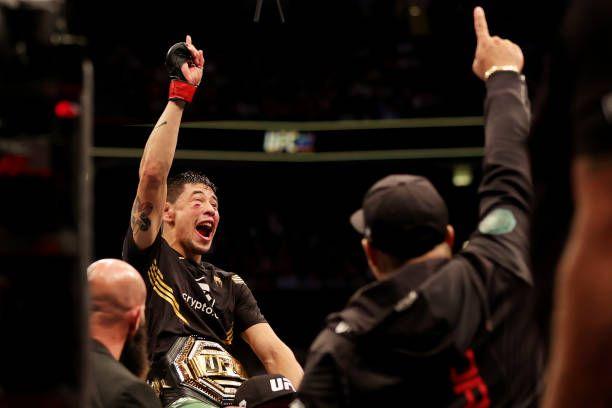 Brandon Moreno winning the Interim Flyweight Championship at UFC 277. Credits to: Carmen Mandato-Zuffa LLC.