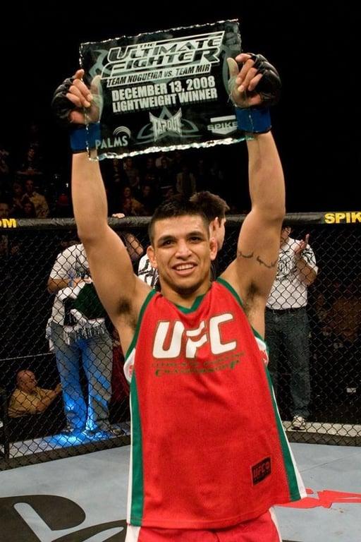Efrain Escudero raises his plaque in celebration. Credits to: Zuffa LLC-Getty Images