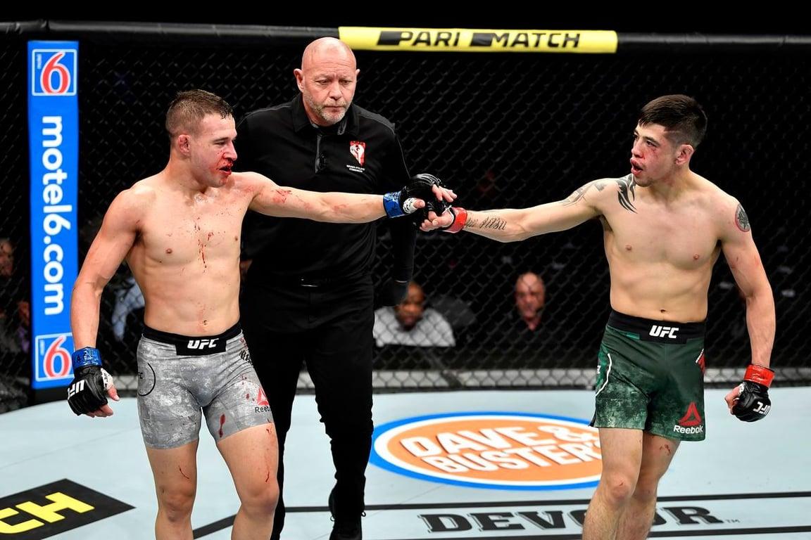 Kai Kara-France and Brandon Moreno showing respect in their title fight clash. Credits to: Jeff Botrai - Zuffa LLC.