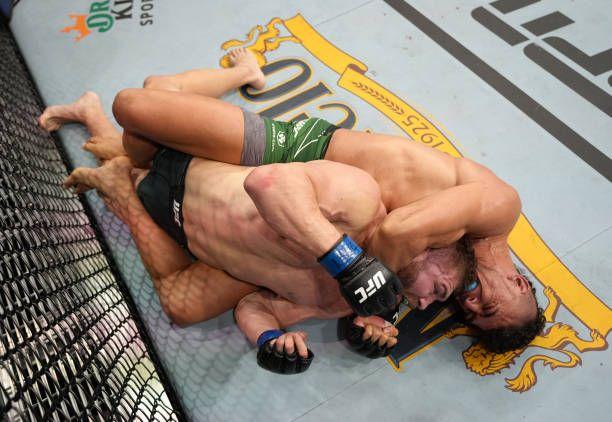 Johnny Walker submitting Ion Cutelaba at UFC 279. Credits to: Jeff Bottari-Zuffa LLC.