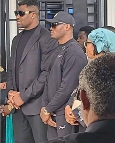 Kamaru Usman standing by Francis Ngannou during the funeral for Ngannou’s son 
