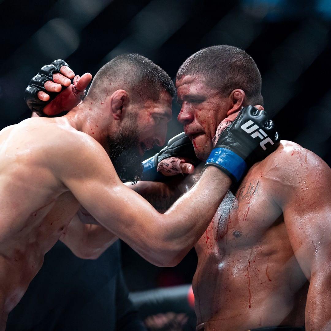 Khamzat Chimaev and Gilbert Burns embrace after their fight. Credits to: The Mac Life.