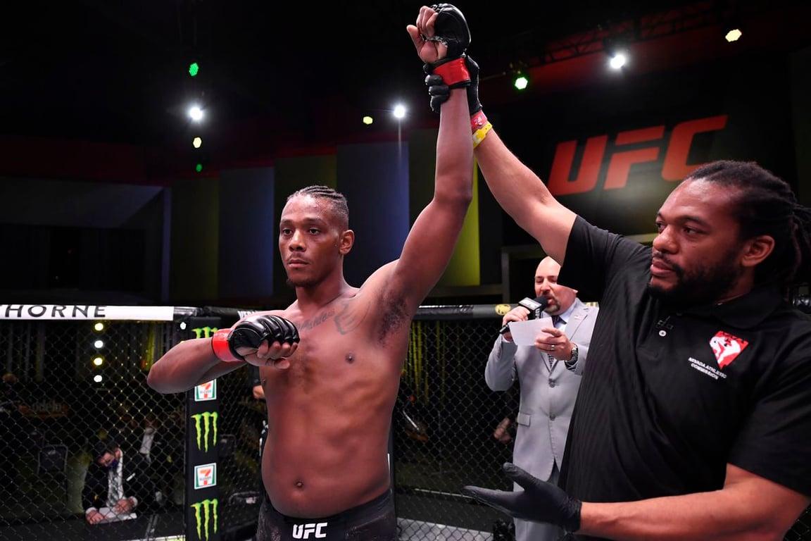 Hill gets his hand raised after finishing OSP (Getty Images)