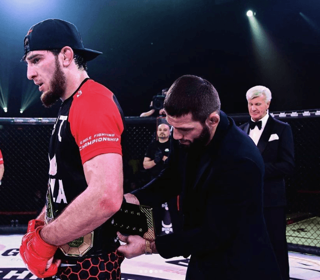 Umalatov getting the belt wrapped around his waist at EFC 31 after securing the welterweight belt. Photo by Magomed Umalatov Instagram.