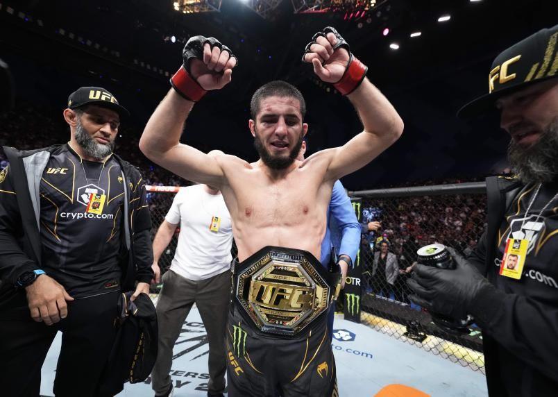 Islam Makhachev dons his belt after defeating Alexander Volkanovski. Credits to: Zuffa LLC.