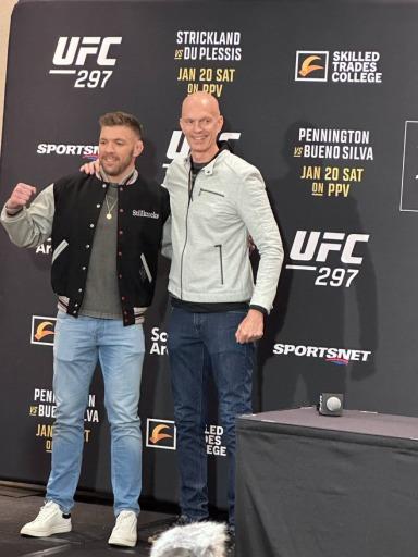 Jeff Novitzky hands Dricus Du Plessis a jacket for 50 clean drug tests.