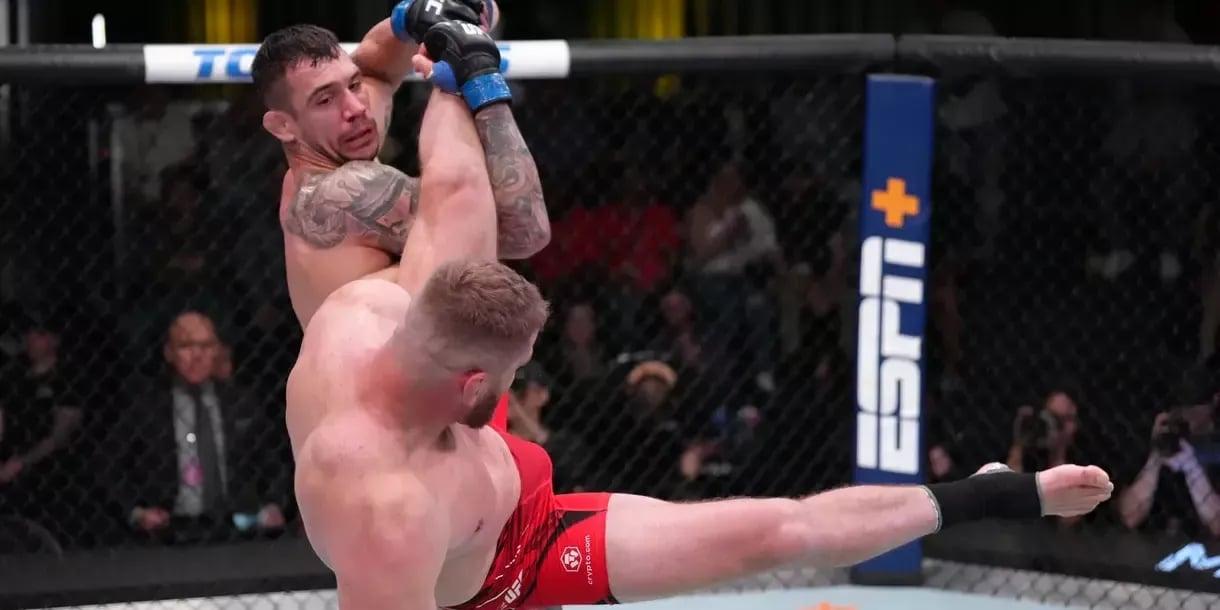 Aleksandar Rakic taking Jan Blachowicz down in their main event fight. Credits to: Jeff Botari - Zuffa LLC.