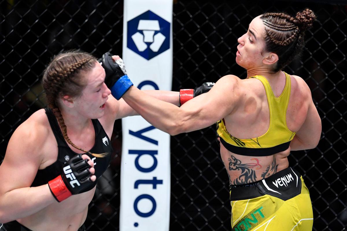 Norma Dumont cracks Aspen Ladd with an uppercut. Credit: MMAMania.