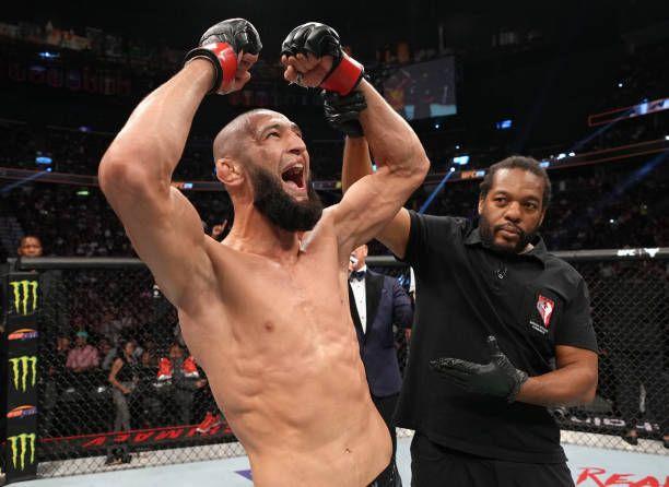 Khamzat Chimaev getting his hand raised after defeating Kevin Holland at UFC 279. Credits to: Jeff Bottari-Zuffa LLC.
