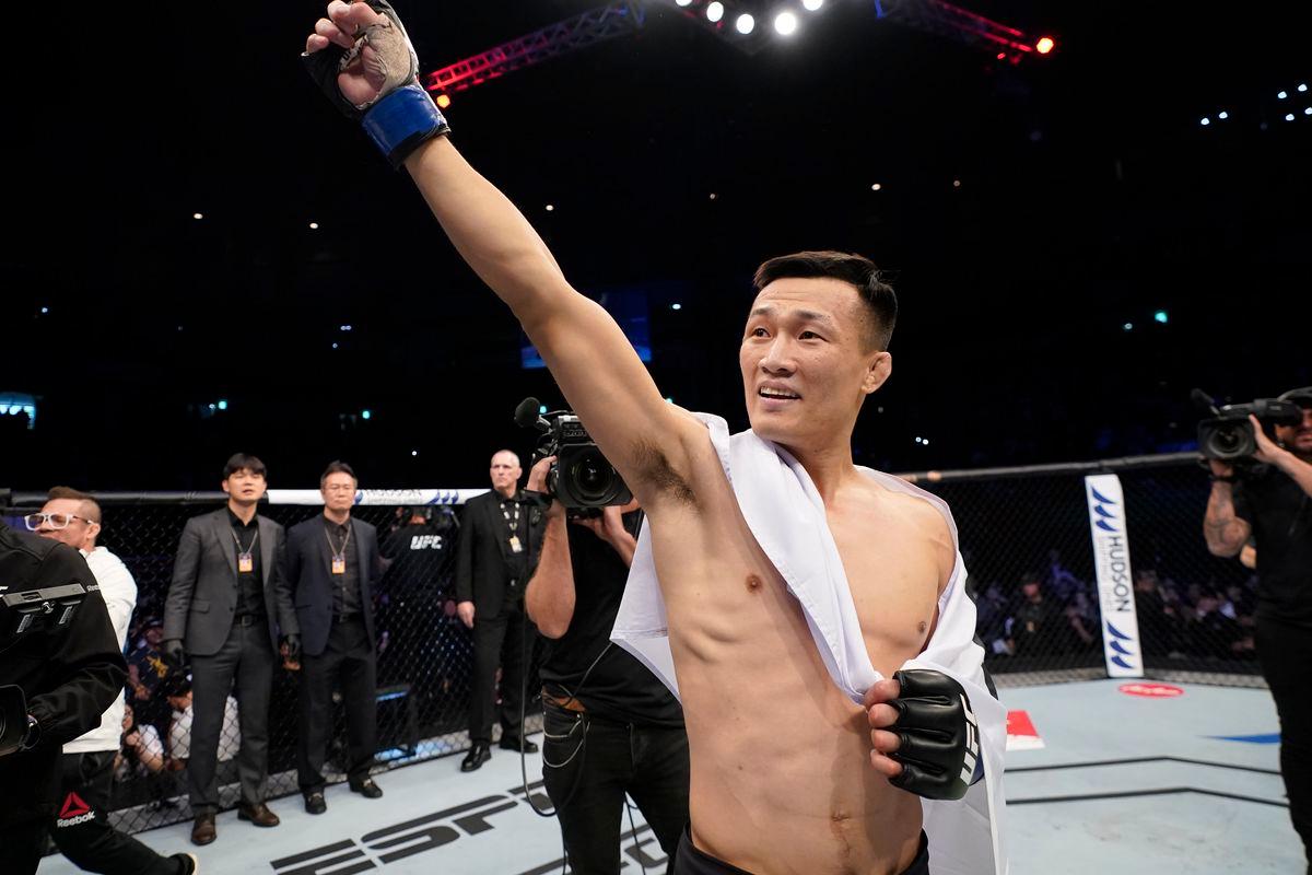 Chan Sung Jung motions to the crowd after a win.  Credits to: Jeff Bottari-Zuffa LLC via Getty Images.