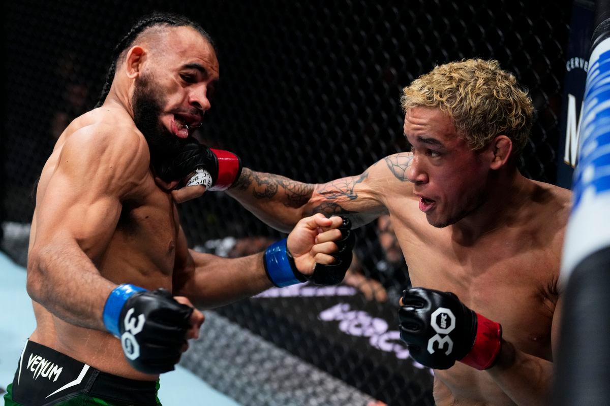 Bryan Battle blasts Gabe Green with a right hand. Credit: MMA Fighting.