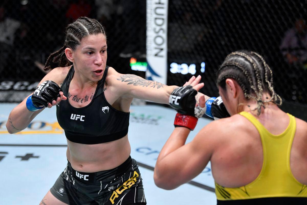 Karol Rosa pops Bethe Correia with a jab. Credit: MMAFighting.
