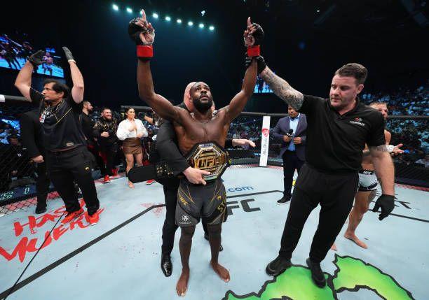 Aljamain Sterling getting the belt wrapped around his waist after defeating TJ Dillashaw. Credits to: Chris Unger-Getty Images.
