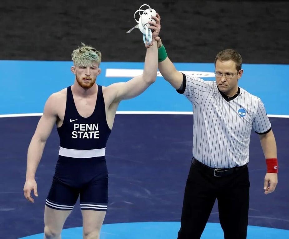 Bo Nickal, left, wins his 197-pound match against Ohio State's Kollin Moore in the finals of the NCAA wrestling championships. Photo/Gene J. Puskar