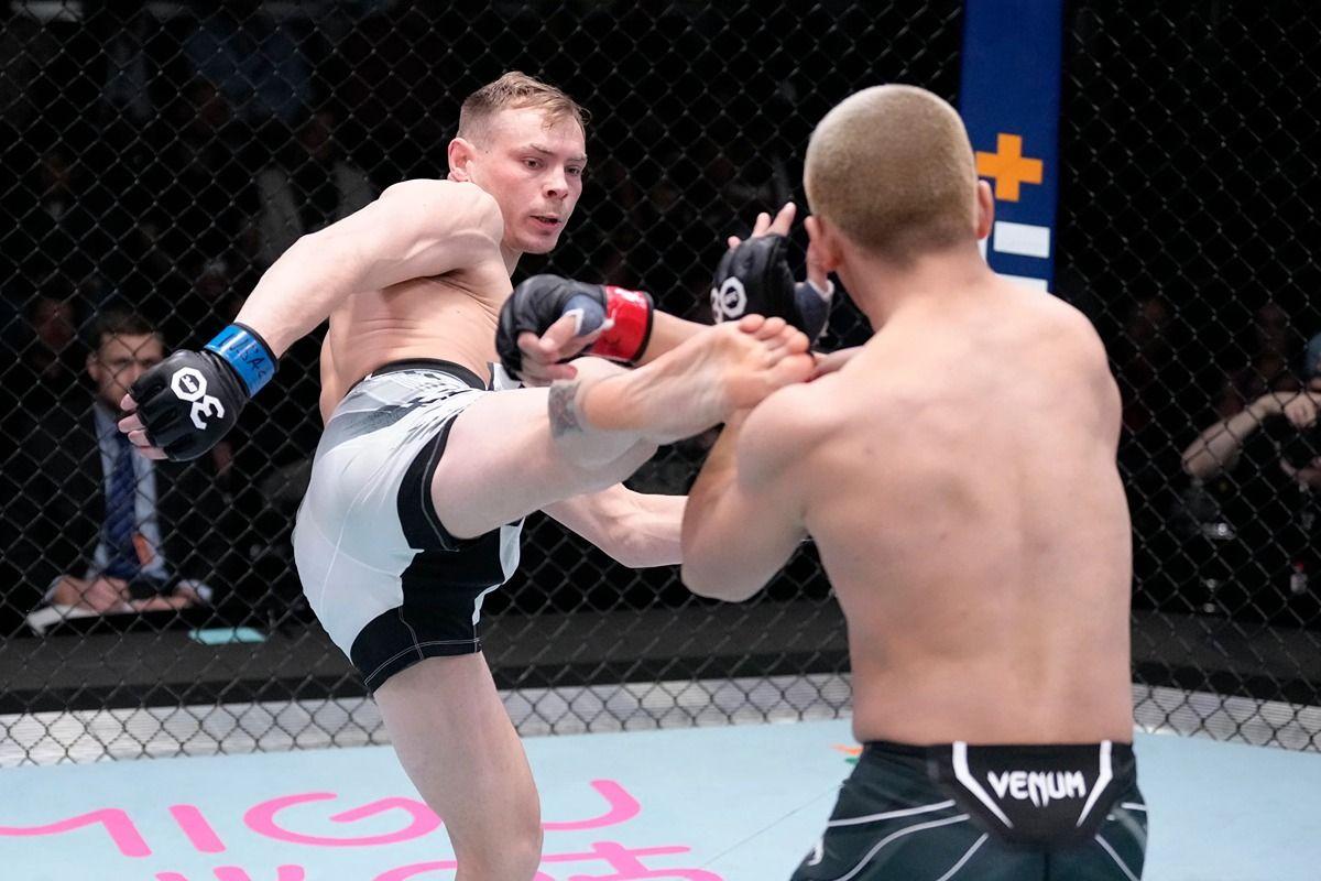Adam Fugitt fires a head kick at Yusaku Kinoshita. Credit: MMA Junkie.