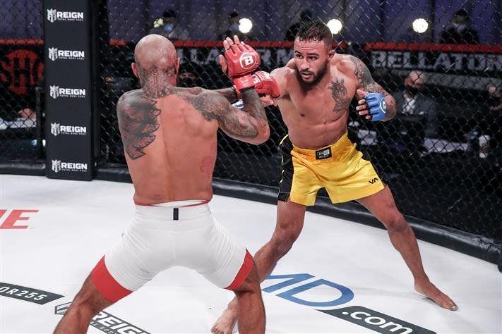 Chris Gonzalez lands a jab on Roger Huerta. Credit to: Cageside Press.