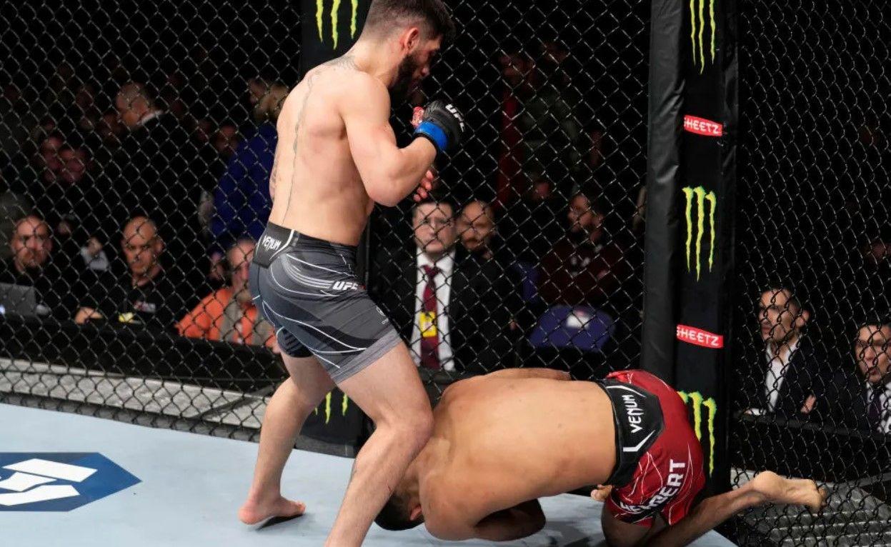 Ilia Topuria standing over Jai Herbert after knocking him out in London. Credits to: Chris Unger - Zuffa LLC.