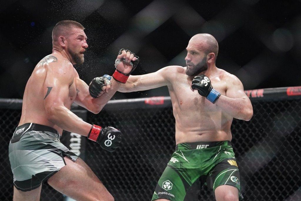 Azamat Murzakanov landing a hook vs. Justin Jacoby. Credits to: Denny Medley - USA TODAY Sports.