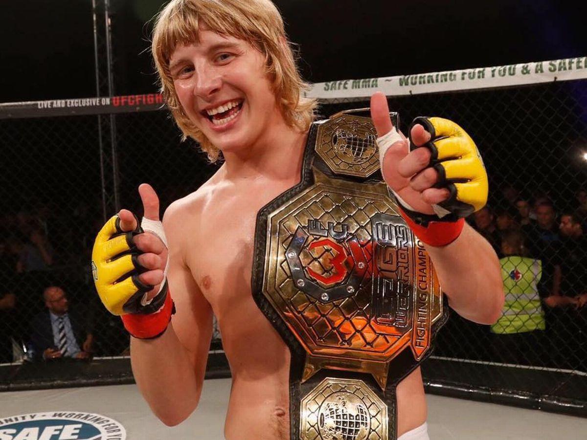Paddy Pimblett holding the Cage Warriors Featherweight title. Credits to: Cage Warriors.