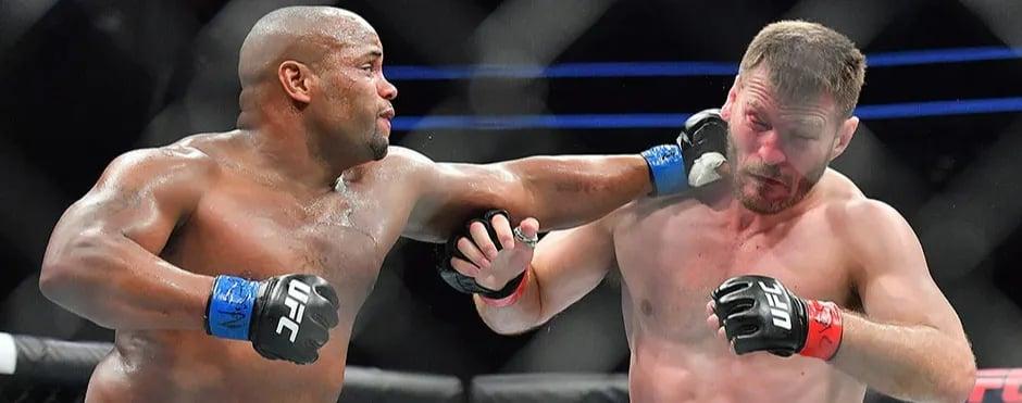 Daniel Cormier landing on Stipe Miocic in their first fight. Credits to: Stephen R. Sylvanie - USA TODAY Sports.