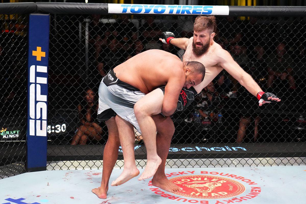 Rodrigo Nascimento takes Tanner Boser off his feet with a takedown. Credit: MMA Fighting.