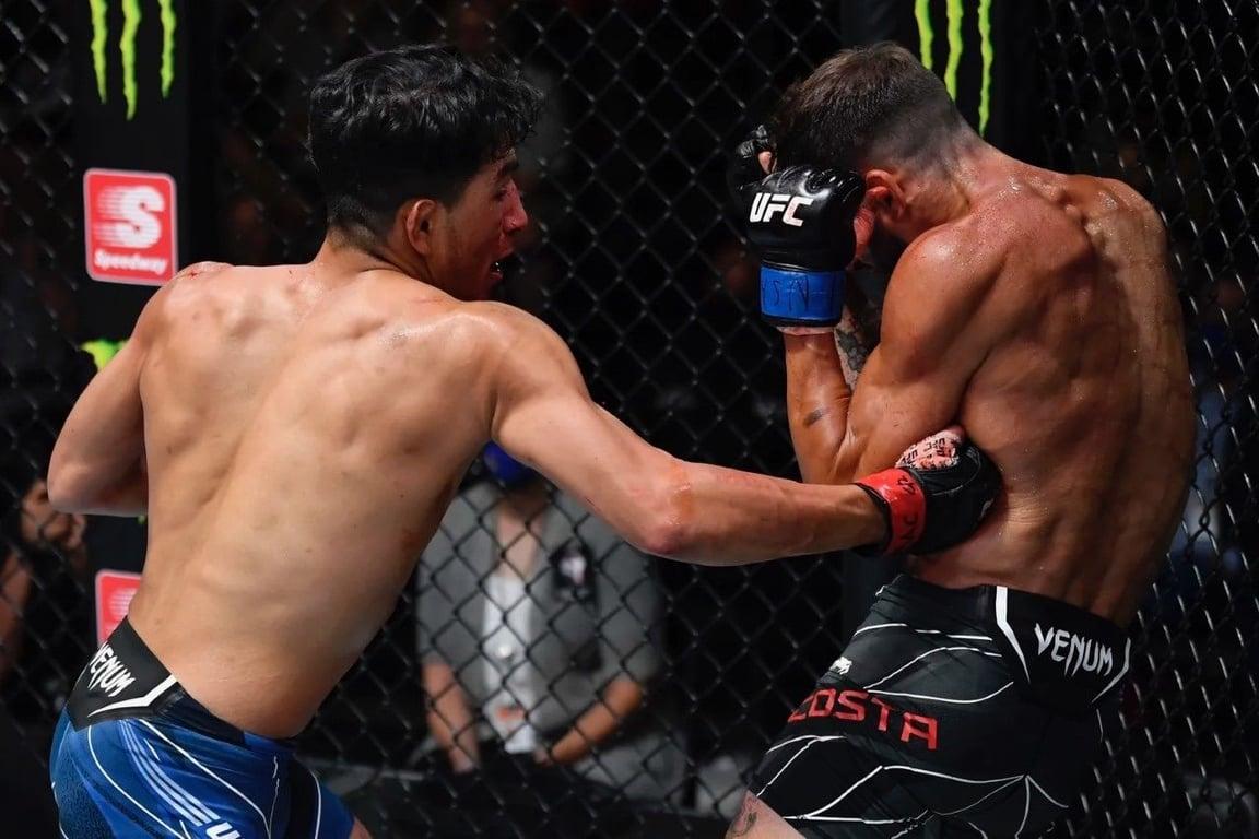 Adrian Yanez putting a body shot on Randy Costa. Credits to: Zuffa LLC.