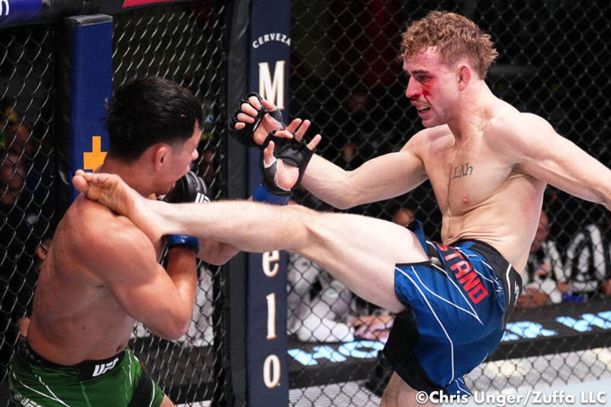 Brady Hiestand unloads a head kick onto Fernie Garcia. Credit: Chris Unger/Zuffa LLC.