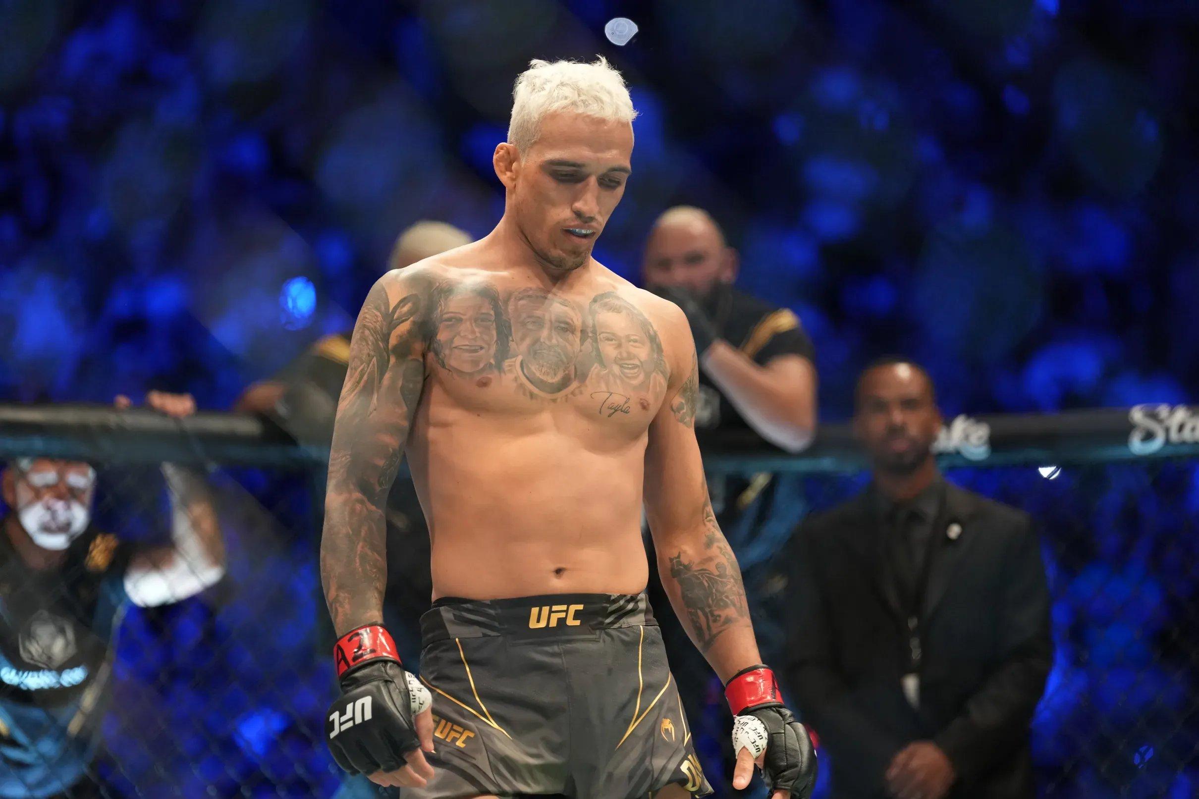 Charles Oliveira takes a moment of serenity in the UFC Octagon. Credit: Louis Grasse - PxImages - Icon Sportswire via Getty Images.