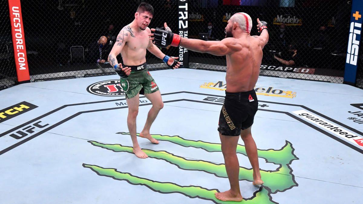 Deiveson Figueiredo and Brandon Moreno enjoying their war. Chris Unger/Getty Images