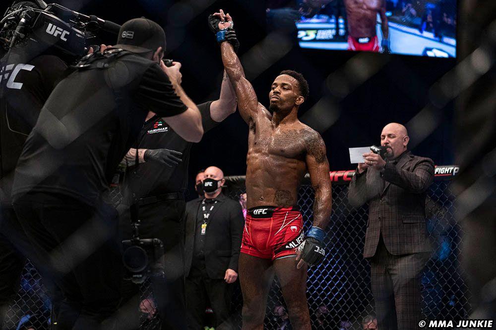 Murphy gets his hand raised after a win. Photo by MMAJunkie.