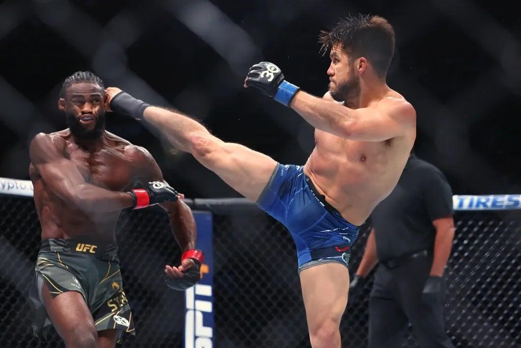 Henry Cejudo clippling Aljamain Sterling with a head kick at UFC 288. Credits to: Ed Mulholland - USA TODAY Sports.
