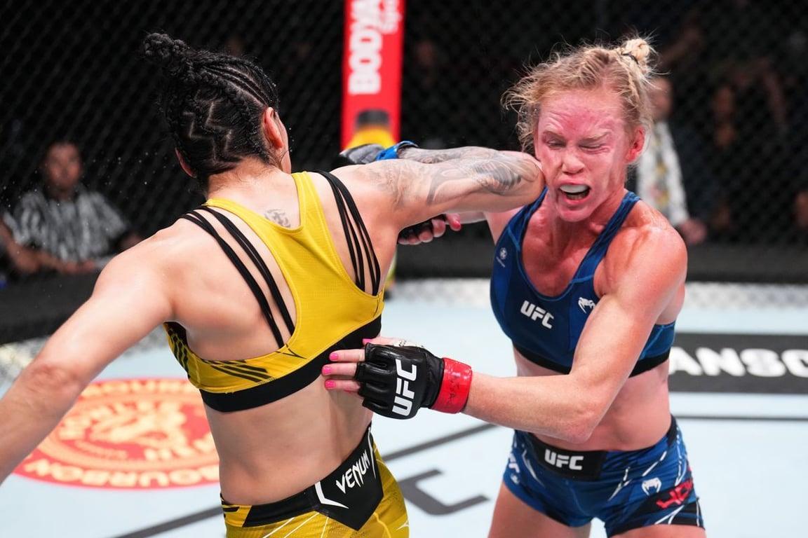 Ketlen Vieira lands spinning elbow on Holly Holm. Credits to: Chris Unger/Zuffa LLC.