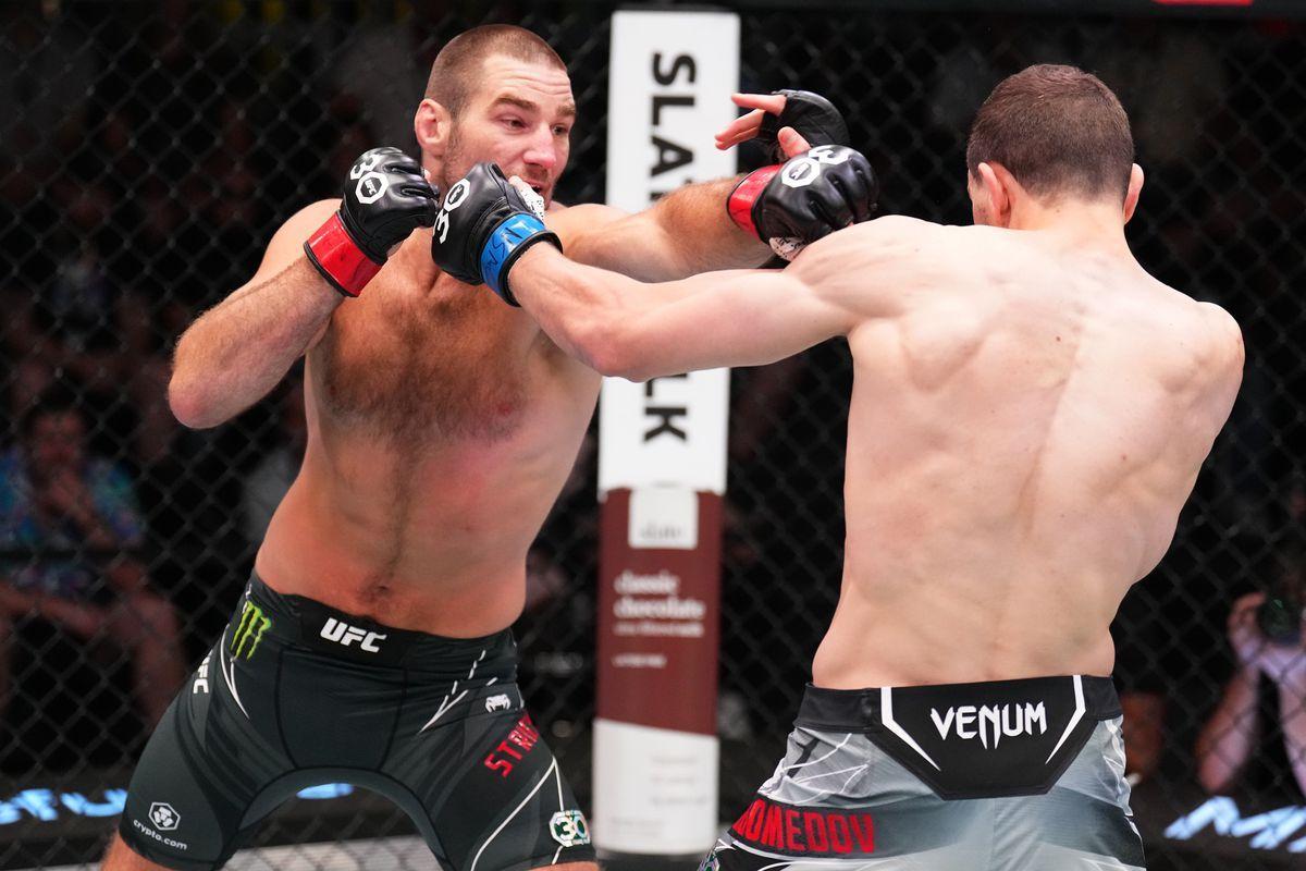 Abus Magomedov exchanges blows with Sean Strickland. Credit: MMA Fighting.