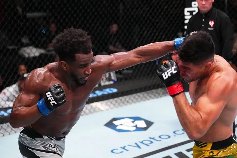 Vicente Luque striking with Geoff Neal before suffering a third-round TKO. Credits to: Chris Unger - Zuffa LLC.