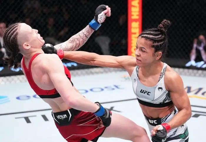 Natália Silva finishes Tereza Bleda with a spinning-back-kick. Photo by Chris Unger, Zuffa LLC.